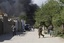 Afghan security forces are seen after a suicide attack on the U.S.-led provincial reconstruction team (PRT) compound in the Behsood district of Jalalabad, east of Kabul Afghanistan, on Sunday, April 15, 15 2012.