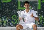 Novak Djokovic, of Serbia, holds the trophy after defeating Andy Murray, of Britain, during the men's singles final of the Sony Ericsson tennis tournament, Sunday, April 1, 2012, in Key Biscayne, Fla. Djokovic won 6-1, 7-6 (4).