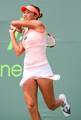 Shaui Zhang of China competes against Elena Baltacha of Great Britain during the Day 2 of qualifying rounds of the Sony Ericsson Open at Crandon Park Tennis Center on March 20, 2012 in Key Biscayne, Florida - USA.