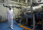 In this Feb. 2007 file photo, an Iranian technician walks through the Uranium Conversion Facility just outside the city of Isfahan 255 miles (410 kilometers) south of the capital Tehran, Iran.