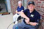 MUNCIE, Ind. - Husband and wife William D. Barber Sr. and Leona Barber sit on the front patio at their home following William's Coast Guard promotion to honorary motor machinist's mate first class July 7, 2011, more than 69 years after he was honorably discharged from the service following an injury on a Coast Guard patrol boat during World War II. Barber was in the engine room of the patrol boat, used to spot German u-boats off the east coast of the United States, when an explosion occured, sev