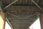 The George C. Platt Memorial Bridge is a through truss bridge that carries PA 291 (Penrose Avenue) over the Schuylkill River in Philadelphia, Pennsylvania. Underside of eastern approach, showing rusting girders.