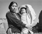 Navajo woman and child, photographed by Ansel Adams, c. 1944.The first humans of the Colorado River basin were likely Paleo-Indians of the Clovis and Folsom cultures, who first arrived on the Colorado Plateau about 12,000 years ago.