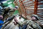 U.S. Army Capt. Gary Chura and Lt. Col. Brent Beckley of the Nagarhar Agri-business Development Team, inspect a local agricultural processing plant, March 17, 2012. The mission of the ADT is to support initiatives that will ensure the sustainability of Afghan agricultural productivity.