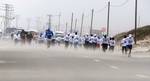 Participants compete in the UN-sponsored Gaza marathon in Beit Hanun in the northern Gaza Strip on March 1, 2012. Thousands of runners braved temperatures hovering just above zero degrees centigrade to take part in the impoverished Palestinian territory's second-ever marathon.