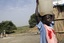 File - Sudanese Red Crescent volunteers hand out chlorine tablets supplied by UNICEF at water gathering points along the river Nile