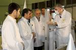 This photo released by the Iranian President's Office, claims to show Iranian President Mahmoud Ahmadinejad, second left being escorted by technicians during a tour of Tehran's research reactor centre in northern Tehran, Iran, Wednesday Feb. 15, 2012. In defiant swipes at its foes, Iran said Wednesday it is dramatically closer to mastering the production of nuclear fuel even as the U.S. weighs tougher pressures and Tehran's suspected shadow war with Israel brings probes far beyond the Middle Eas