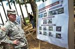 Army Gen. Martin E. Dempsey, chairman of the Joint Chiefs of Staff reads one of the information charts during his visit to Joint Task Force-Volcano near Tibu, Colombia, on March 27, 2012. Dempsey was visiting the country to reaffirm ties and find better ways to partner with the ally. DOD photo by U.S. Army Staff Sgt. Sun L. Vega, Joint Staff