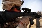 Lance Cpl. Marcus Schuh from Freedom, Wis., squad automatic weapon gunner, 3rd Squad, 2nd Platoon, Alpha Company, 1st Battalion, 8th Marine Regiment, holds a security overwatch position during Operation Speargun in Urmuz, Afghanistan, March 27, 2012.