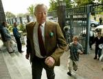 Sir Mark Thatcher, son of a former British Prime Minister Margaret Thatcher, is pursued by journalists as he arrives in Wynberg Court in Cape Town, South Africa, Thursday, Nov, 25, 2004.