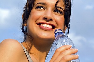 Woman drinking bottled water, exercise, fitness, diet, health, weight loss, nutrition.