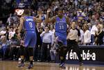 Oklahoma City Thunder's Russell Westbrook (0) ad Kevin Durant (35) celebrate during an NBA basketball game against the Dallas Mavericks Wednesday, Feb. 1, 2012, in Dallas. The Thunder defeated the Mavericks 95-86. (AP Photo/Tony Gutierrez)