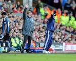 Liverpool's manager Kenny Dalglish, left, and Stoke's manager Tony Pulis react on the touchline during their English FA Cup quarterfinal soccer match at Anfield Stadium, Liverpool, England, Sunday March 18, 2012.