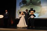 ORLANDO, Fla. -- Lieutenant Commander Zeita Merchant poses for a photo with Mickey and Minnie Mouse while ESPN Sportscaster Jay Harris introduces merchant as one of six honorees recognized for having graduated from a Historically Black College or University. Each honoree received an HBCU Trailblazer Award in recognition of the impact made in his or her respective career and community. Other honorees included Pro Football Hall of Fame member Mel Blount (Southern University) and Super Bowl MVP Dou