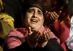 A Kashmiri Muslim woman prays outside a Mosque Mir Sayyid Ali Hamdani, better known as Shah Hamdan in Srinagar, the summer capital of Indian Kashmir, India on 03 November 2011.