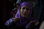 A Kashmiri Muslim woman prays outside a Mosque Mir Sayyid Ali Hamdani, better known as Shah Hamdan in Srinagar, the summer capital of Indian Kashmir, India on 03 November 2011.