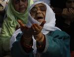 A Kashmiri Muslim woman prays outside a Mosque Mir Sayyid Ali Hamdani, better known as Shah Hamdan in Srinagar, the summer capital of Indian Kashmir, India on 03 November 2011.