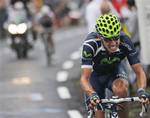 Stage winner Rui Alberto Costa of Portugal, right, breaks away from Tejay Van Garderen of the US, rear left, in the climbs towards Super Besse Sancy pass during the 8th stage of the Tour de France cycling race over 189 kilometers (117.5 miles) starting in Aigurande and finishing in Super Besse Sancy, central France, Saturday July 9, 2011.