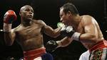 FILE-This Sept. 20, 2009 file photo shows Floyd Mayweather Jr., left, connecting with Juan Manuel Marquez, of Mexico, during their non-title welterweight boxing match in Las Vegas. Mayweather Jr. is either getting incredibly lazy or listening to some incredibly bad advice. He talks about his legacy as a fighter, but unless he meets Manny Pacquiao in November it will be one that will always be diminished. (AP Photo/Laura Rauch,File)