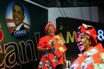 Ndi Okereke-Onyiuke speaks to people at a fund raising campaign for American presidential candidate Barack Obama in Lagos, Nigeria, Monday Aug. 11 2008. The event, held by a group calling itself "Africans for Obama 08," drew hundreds of people from the Nigerian business elite. Each paid more than $2,000 to munch on grilled snails, sip from flutes of Veuve Cliquot and Moet & Chandon and join in a lively, if poorly executed, series of the "fist bumps" popularized by Obama and his wife, Michelle.