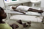 Haiti - A cholera infected girl rests on a hospital cot in Raboto, a slum area of Gonaives located in the Artibonite Region, where the United Nations Children's Fund (UNICEF) is working to contain the cholera outbreak, 9 November, 2011.