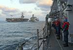 Sailors aboard the Ticonderoga-class guided-missile cruiser USS Cape St. George (CG 71) watch the Military Sealift Command Henry J. Kaiser-class fleet replenishment oiler USNS Guadalupe (T-AO 200)