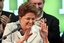 Brazil's President-elect Dilma Rousseff, of the Workers Party, gestures to supporters as she arrives to give her victory speech after winning the election runoff in Brasilia, Brazil, Sunday Oct. 31, 2010.