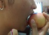 Woman eating apple fruit - Diet