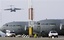 US military planes , are seen at Manas US military base in Bishkek airport Kyrgyzstan on Thursday, Feb. 12, 2009. Kyrgyz President Kurmanbek Bakiyev last week announced the closure of the base, which is a crucial staging post for coalition operations in Afghanistan. The U.S. began using the Manas base in December 200