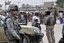 File - A U.S. Soldier stands watch as U.S. National Security Council member Samantha Power and representatives from the United Nations meet with representatives from the Iraqi Ministry of Displacement and Migration regarding internally displaced persons (IDP) at the Kindi IDP Resettlement Center near Baghdad, Iraq, Nov. 16, 2009.