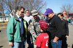 Kansas Gov. Sam Brownback, left, and U.S. Army Maj. Gen. Lee Tafanelli, center, the Kansas adjutant general and director of the state?s Division of Emergency Management, speak with a boy in Harveyville, Kan., March 1, 2012, after an EF-2 tornado struck the area two days earlier. The storm killed one person and injured more than a dozen others as it cut a 5-mile-long path through the town. Brownback visited Harveyville to inspect the damage and meet with residents after declaring a disaster emerg