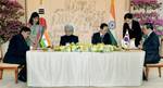 The Secretary (East), Ministry of External Affairs, Government of India, Shri Sanjay Singh and the Vice Minister of Foreign Affairs and Trade, Government Republic of Korea, Mr. Kim sung-han signing the documents in the presence of the Prime Minister, Dr. Manmohan Singh and the South Korean President, Mr. Lee Myung-bak, in Seoul on March 25, 2012.