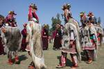 Ladakhi girls, wearing a traditional dress, present a cultural programme during the second day of Kashmir Festival in Srinagar on Sunday, 11, OCT 2009, The dress is typically worn by a community representing the last race of Aryans in the two villages of Ladakh