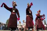 Ladakhi girls, wearing a traditional dress, present a cultural programme during the second day of Kashmir Festival in Srinagar on Sunday, 11, OCT 2009, The dress is typically worn by a community representing the last race of Aryans in the two villages of Ladakh