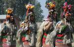 Ladakhi girls, wearing a traditional dress, present a cultural programme during the second day of Kashmir Festival in Srinagar on Sunday, 11, OCT 2009, The dress is typically worn by a community representing the last race of Aryans in the two villages of Ladakh