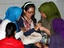 A relative weeps as she waits for the news on the missing Russian airplane at Halim Perdanakusumah airport in Jakarta, Indonesia, Wednesday, May 9, 2012.