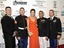 Actress Cobie Smulders, center, poses with members of the U.S. Military before the premiere of "The Avengers" during the 2012 Tribeca Film Festival on Saturday, April 28, 2012 in New York.