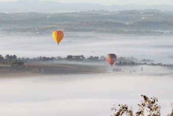 Hot air balloons come in to land at Coldstream airport.