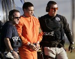  Jose Padilla, center, is escorted by federal marshals at his arrival in Miami, in this Jan. 5, 2006 file photo. Many potential jurors in the Jose Padilla terrorism-support case say they aren´t sure who directed the Sept. 11, 2001, attacks because t