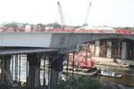 Final sections of northbound lanes of St. Anthony Falls (35W) Bridge were put in place July 5, 2008. The seven foot gap will be closed by poured concrete. View is approximately to the north. The crane, named 