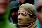 Indian police women form a human chain to impede protest march of labourers demanding better remuneration during a protest march on Labour day in Srinagar. the summer capital of Indian Kashmir, 01 May 2012. Reports state that though a Public holiday in more than 80 countries, the labour leaders in Srinagar told media their collegues at many construction sites were denied holiday by the companies. Rallies and marches were staged by labourers in Srinagar to mark the labour day.