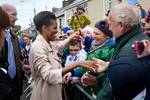 President Barack Obama and First Lady Michelle Obama greet people as they walk along Main Street in Moneygall, Ireland, May 23, 2011.