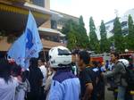 Batam,Indonesia on November 23,2011 - Demo workers in Batam ended chaos. The protesters entered the office of Mayor of Batam pages and destroy various facilities there,They march demanding a wage increase from Rp 1.3 million in 2011 to Rp 1.7 million in 2012