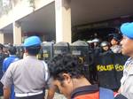 Batam ,Indonesia on November 23,2011- Demo workers in Batam ended chaos. The protesters entered the office of Mayor of Batam pages and destroy various facilities there, They march demanding a wage increase from Rp 1.3 million in 2011 to Rp 1.7 million in 2012