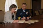 WASHINGTON - Rear Adm. Kevin Cook, Coast Guard Director of Prevention Policy, and Cynthia Giles, Environmental Protection Agency Assistant Administrator, Enforcement and Compliance Assurance, sign a Coast Guard and EPA Vessel General Permit Memorandum of Understanding at EPA Headquarters, Feb. 11, 2011. The Vessel General Permit MOU outlines the cooperative efforts that the Coast Guard and the EPA will undertake to ensure that vessels comply with Vessel General Permit requirements. U.S. Coast Gu