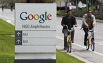 Google workers ride bikes outside of Google headquarters in Mountain View, Calif., Thursday, April 12, 2012.