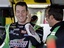 NASCAR driver Kyle Busch talks with crew members in the garage during practice for the NASCAR Sprint Cup Series Auto Race at Dover International Speedway in Dover, De., Friday, Sept. 19, 2008.