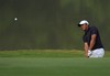 Jhonattan Vegas of Venezuela hits the ball at the 15th hole during the Round 3 of the Omega Mission Hills World Cup golf tournament in Dongguan, southern China's Guangdong province