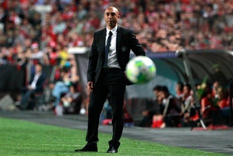 Chelsea's coach Roberto Di Matteo from Italy follows the action from the sideline during their Champions League quarterfinals soccer match with Benfica at Benfica's Luz stadium in Lisbon, Tuesday, March 27, 2012.