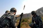 110211-A-xxxxW-003 U.S. Army soldiers fire a 60 mm mortar round during Cobra Gold on Pulon Range, Thailand, on Feb. 11, 2011. Cobra Gold is a joint forces, multinational exercise designed to ensure regional peace and stability. DoD photo by Staff Sgt. Matthew E. Winstead, U.S. Army. (Released)